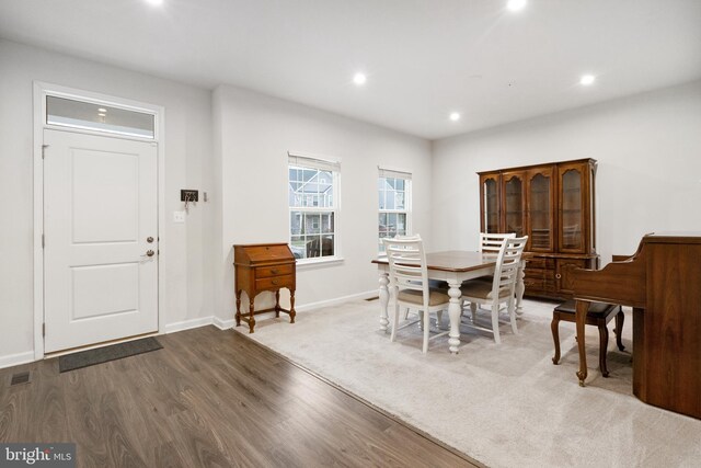 dining area featuring dark wood-type flooring