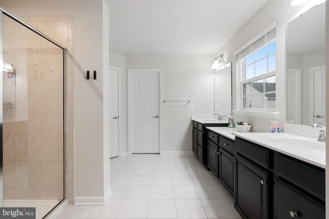 bathroom with vanity, an enclosed shower, and tile patterned floors