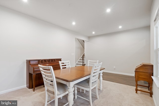 dining area with light carpet