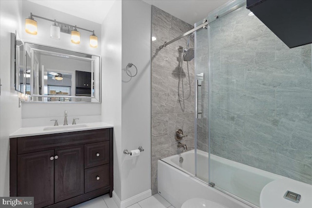 full bathroom with tile patterned floors, toilet, vanity, and shower / bath combination with glass door