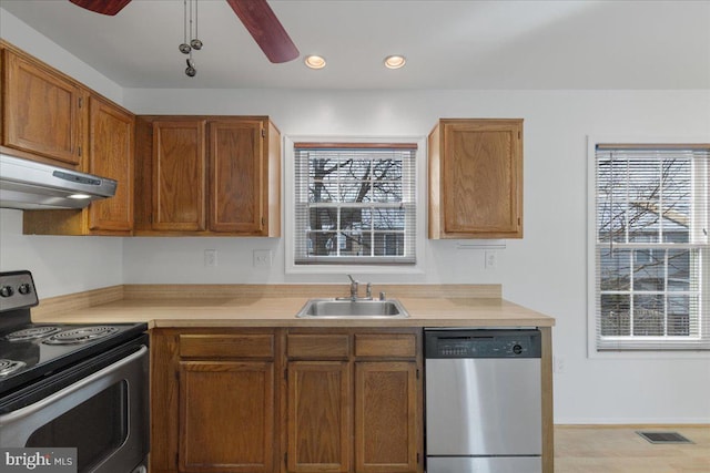 kitchen featuring ceiling fan, appliances with stainless steel finishes, sink, and a wealth of natural light