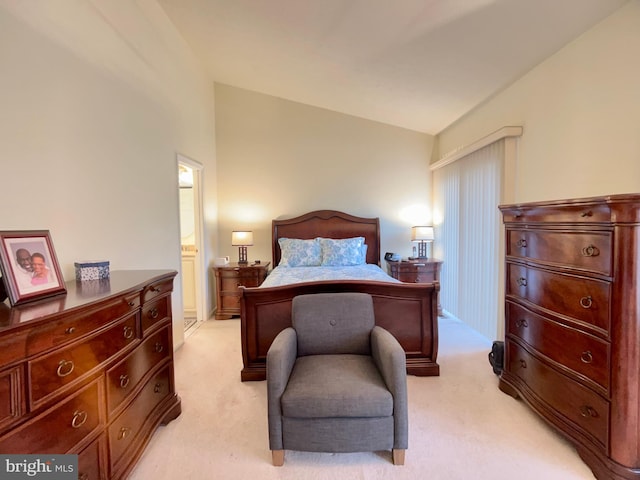 carpeted bedroom featuring lofted ceiling