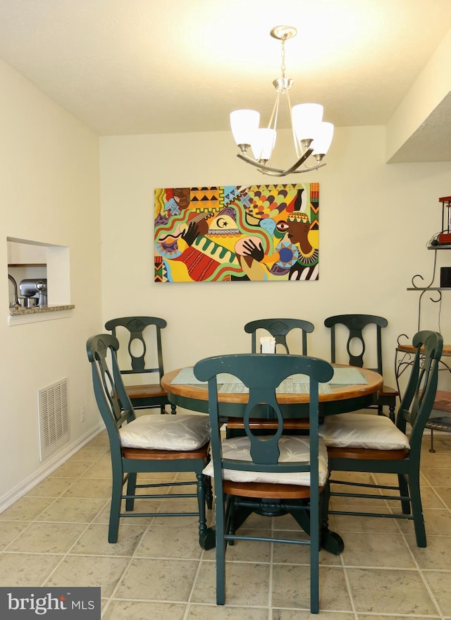 dining area with a notable chandelier