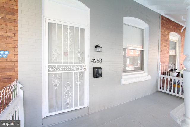 doorway to property featuring a porch