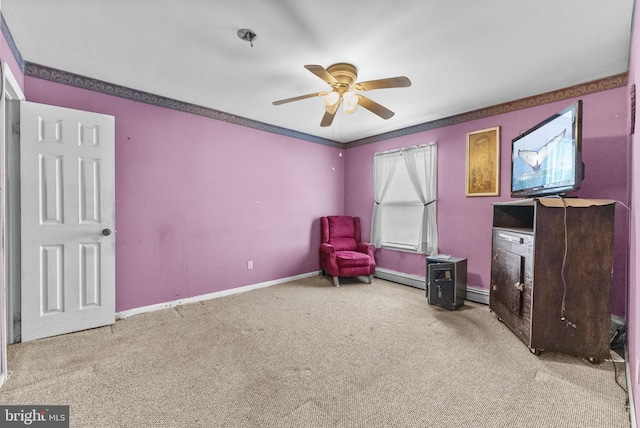 sitting room with a baseboard radiator, carpet flooring, ceiling fan, and baseboards