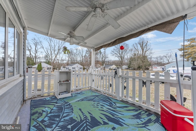 view of patio featuring ceiling fan and a residential view