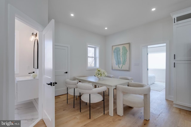 dining space featuring light wood-type flooring