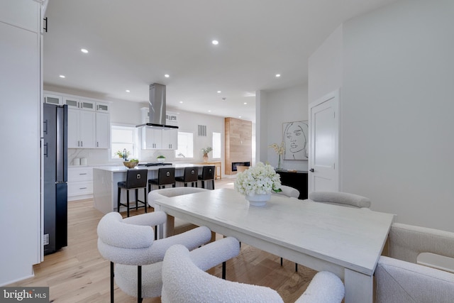 dining space featuring light hardwood / wood-style floors