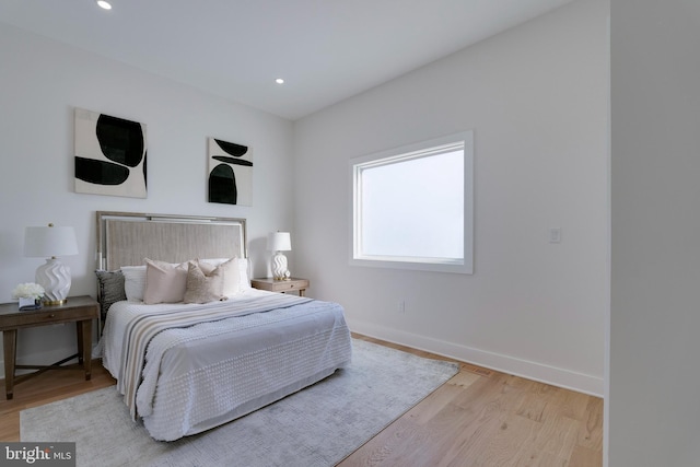 bedroom with light hardwood / wood-style floors