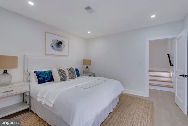 bedroom with light wood-type flooring