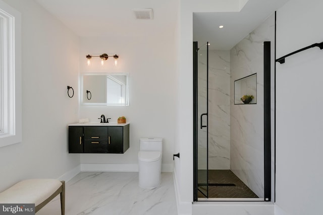 bathroom with toilet, vanity, and an enclosed shower