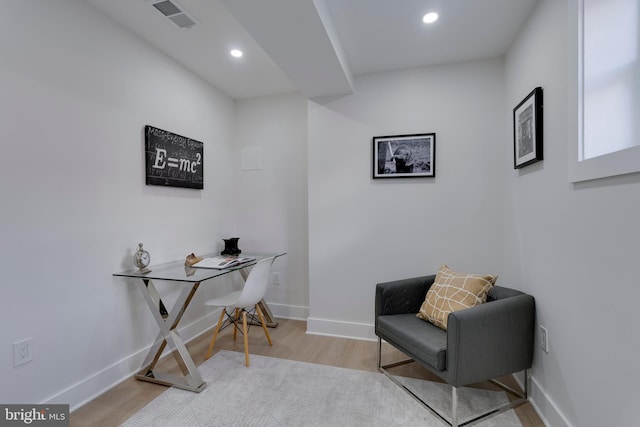 sitting room featuring light hardwood / wood-style floors