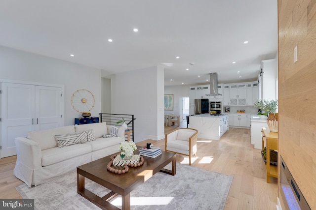 living room with light hardwood / wood-style flooring