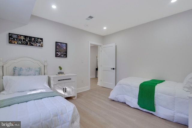 bedroom featuring light hardwood / wood-style flooring