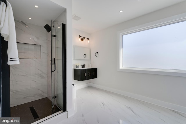 bathroom with vanity and a shower with door