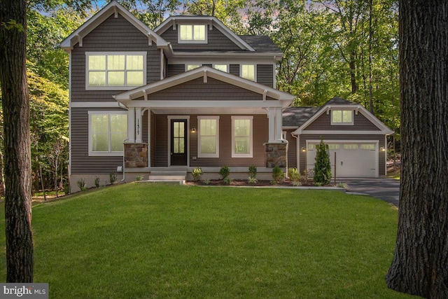 craftsman-style house with a front lawn and covered porch