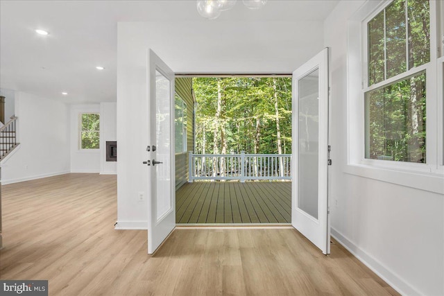 doorway to outside with light hardwood / wood-style flooring