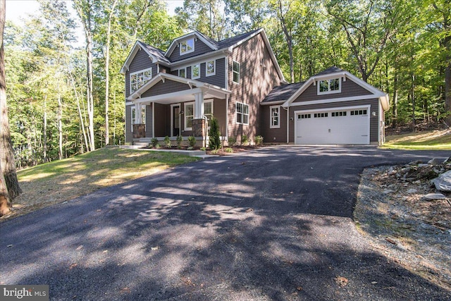 craftsman-style house with a porch and a garage