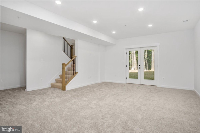 interior space featuring light carpet and french doors