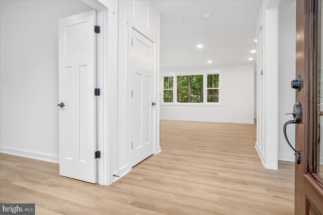 hall with light wood-type flooring