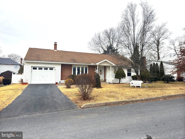 ranch-style home with a garage