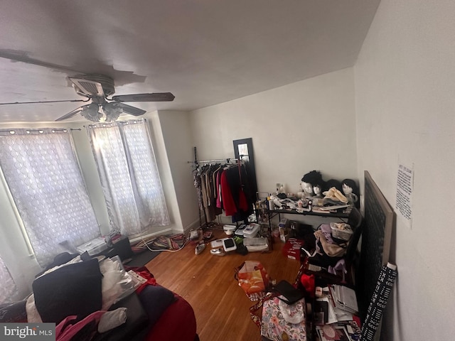 bedroom featuring ceiling fan and wood-type flooring