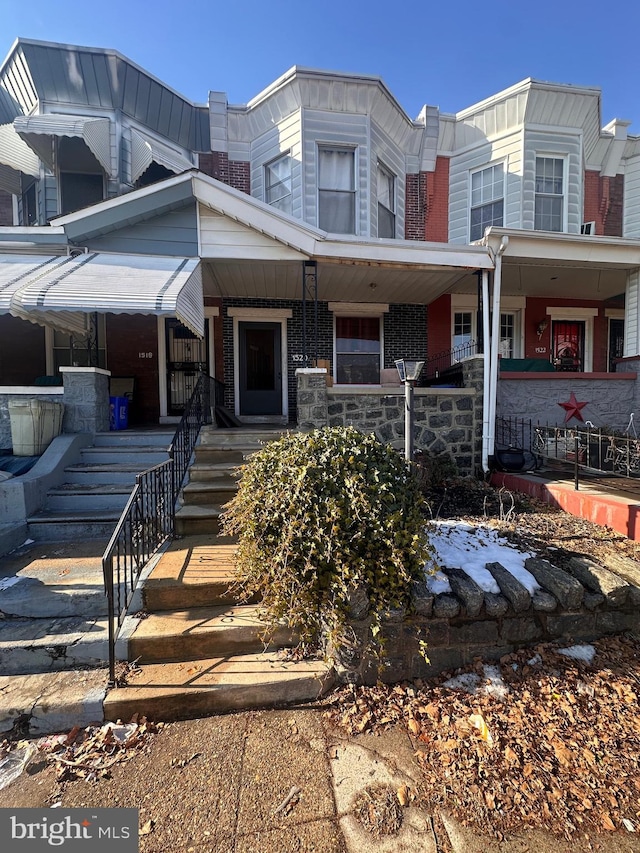 view of property with covered porch