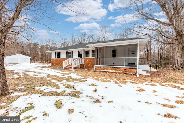 exterior space with a garage and an outdoor structure