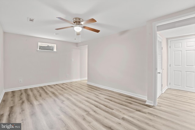 spare room featuring ceiling fan and light hardwood / wood-style flooring