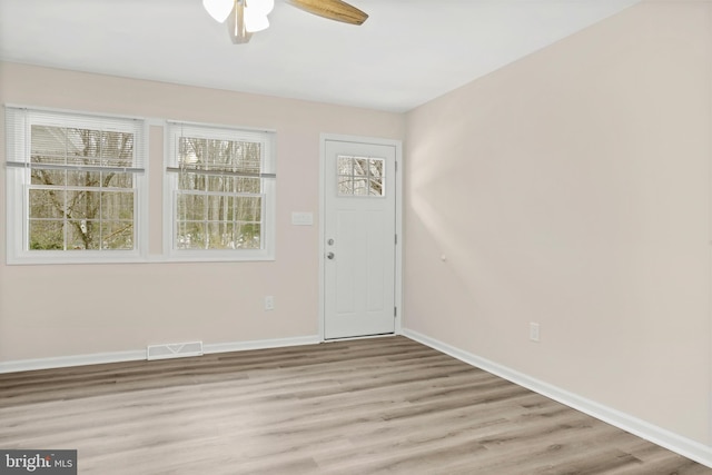 foyer entrance featuring light hardwood / wood-style flooring and ceiling fan