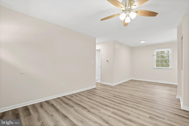 spare room with ceiling fan and light hardwood / wood-style flooring