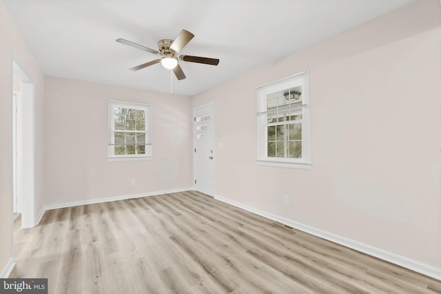 unfurnished room with light hardwood / wood-style floors and ceiling fan