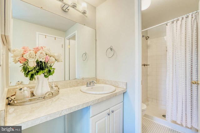 bathroom featuring vanity, toilet, tile patterned floors, and a shower with shower curtain