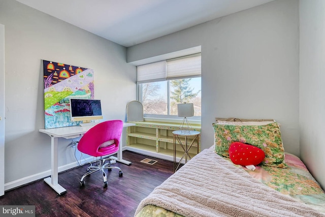 bedroom featuring dark wood-type flooring