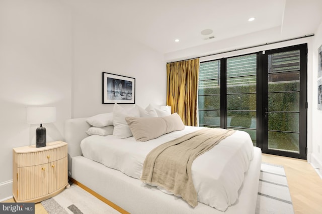 bedroom with light hardwood / wood-style flooring