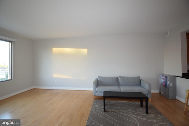 sitting room featuring wood-type flooring