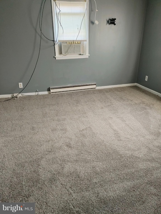 carpeted spare room with a baseboard heating unit and cooling unit