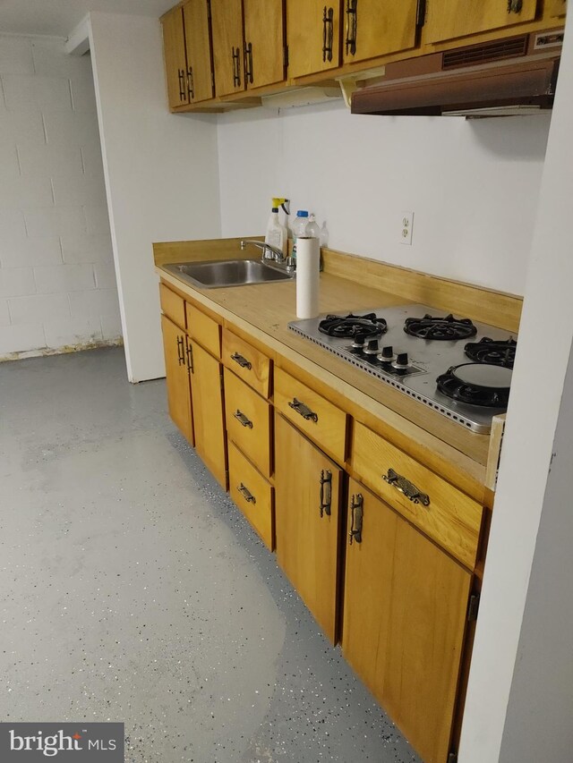 kitchen featuring white gas cooktop and sink