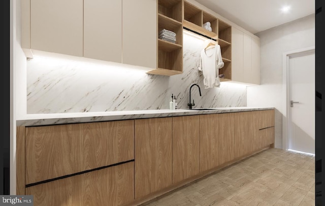 kitchen with tasteful backsplash and sink