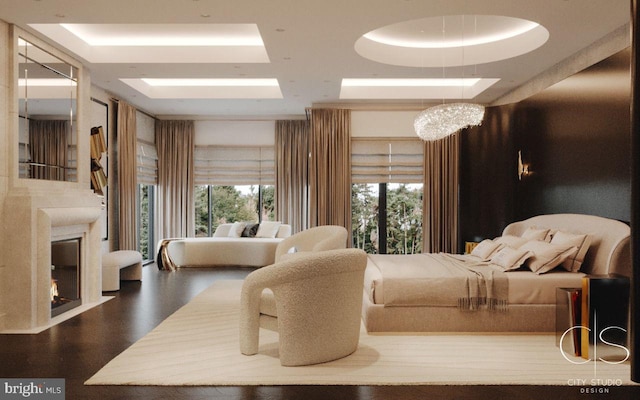 bedroom featuring a tray ceiling and an inviting chandelier