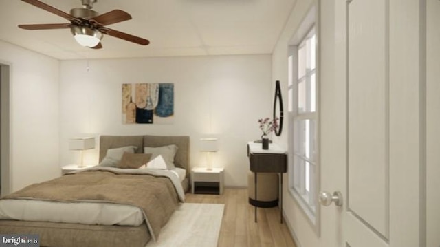 bedroom with ceiling fan and light hardwood / wood-style flooring