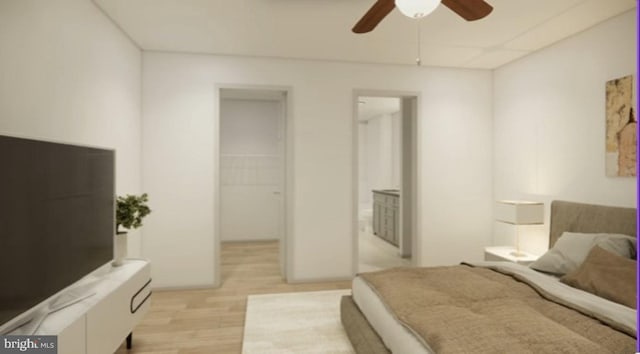 bedroom with a closet, a walk in closet, ceiling fan, and light hardwood / wood-style flooring