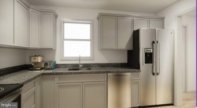 kitchen with sink, gray cabinets, and stainless steel appliances