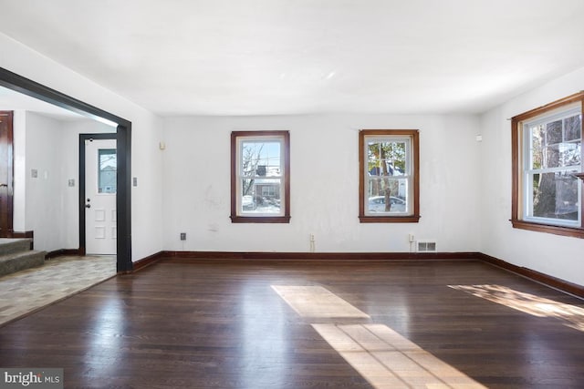 spare room with dark hardwood / wood-style flooring