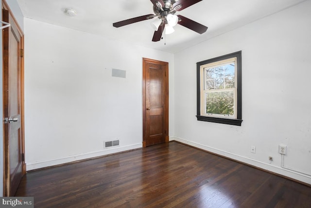 unfurnished room featuring ceiling fan and dark hardwood / wood-style floors