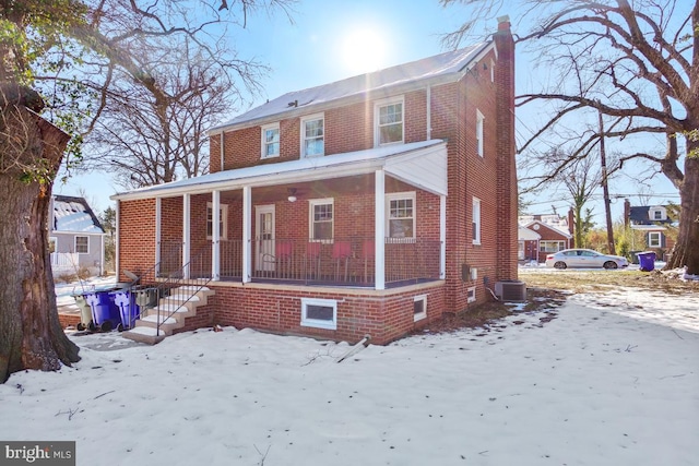 view of front of house featuring covered porch and central AC