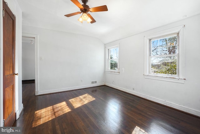 spare room featuring ceiling fan, dark hardwood / wood-style floors, and lofted ceiling