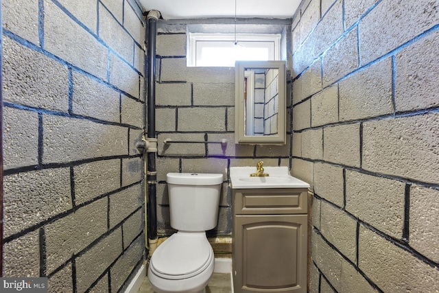 bathroom featuring toilet and vanity