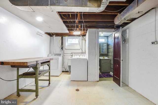 basement featuring sink and washer and clothes dryer