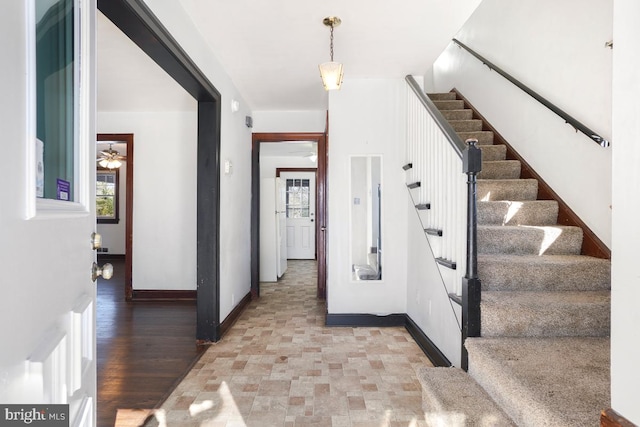 interior space with ceiling fan